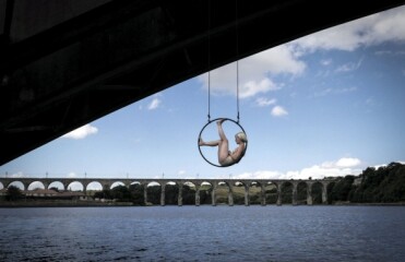 composition x 2013 002 women hanging in circle over bridge